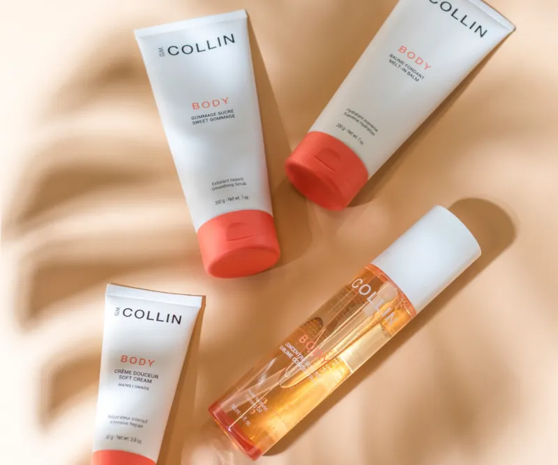 GM Collin skin-care tubes and bottle on a warm shadowed ground